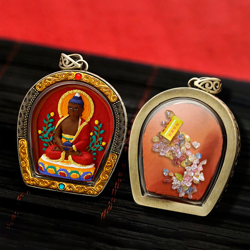 Close-up of 3D hand-painted Yellow Jambhala thangka pendant with intricate Tibetan details