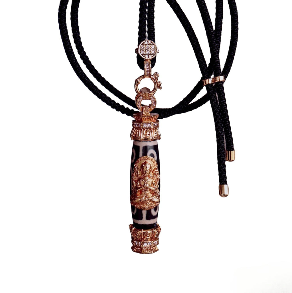 Nine eyed Tibetan dzi bead pendant with Four-Armed Chenrezig for protection and prosperity