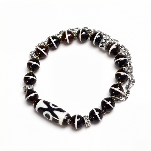 Aurafeng Tibetan bracelet with three-eye dzi bead and old West Asian inlaid details