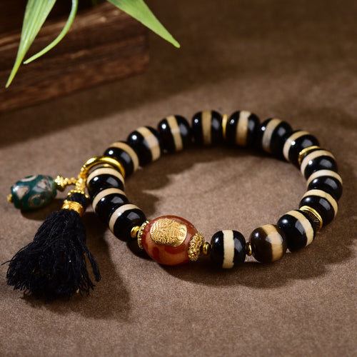 Tibetan dzi bead bracelet styled for yoga and meditation practice