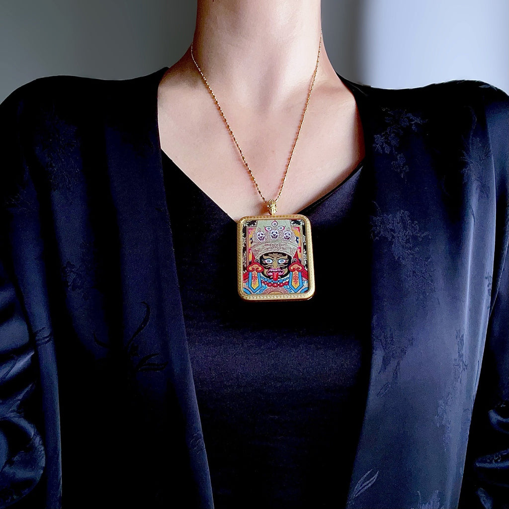 Green Tara pendant worn as Buddhist spiritual amulet