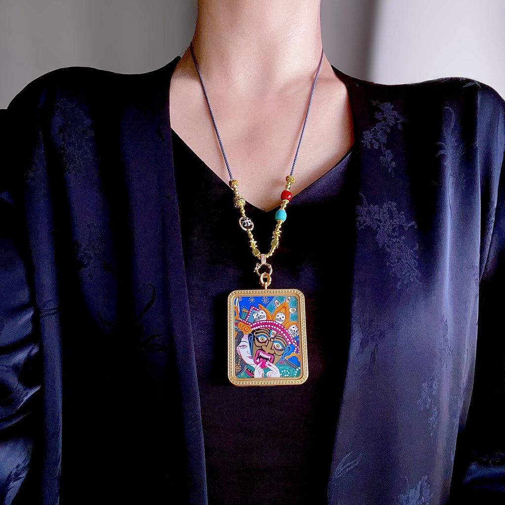Green Tara pendant worn as Buddhist spiritual amulet