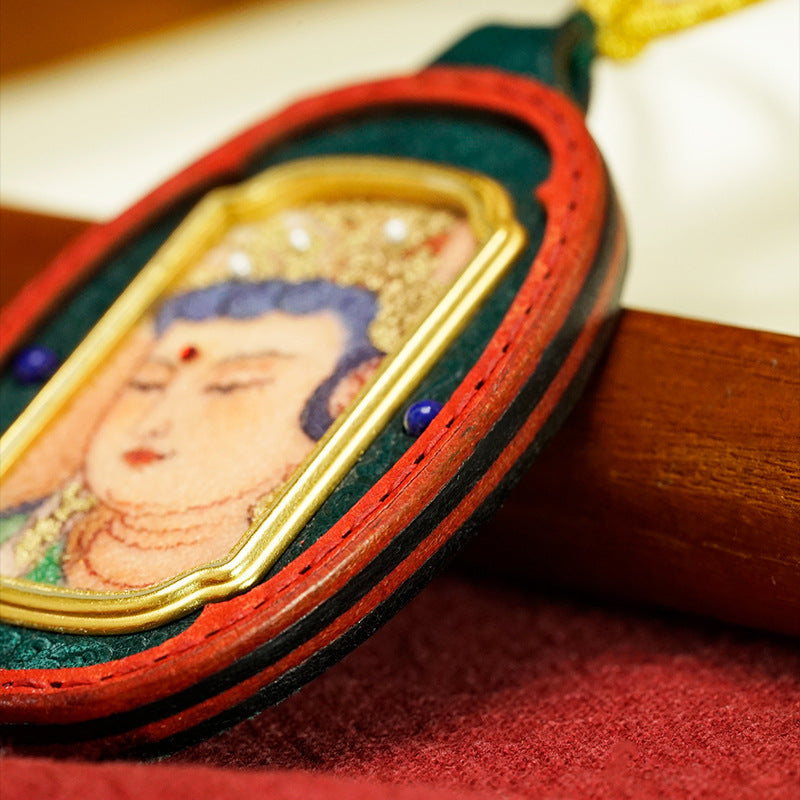 Close-up of hand-painted Thangka detail on Tibetan Gau Box necklace