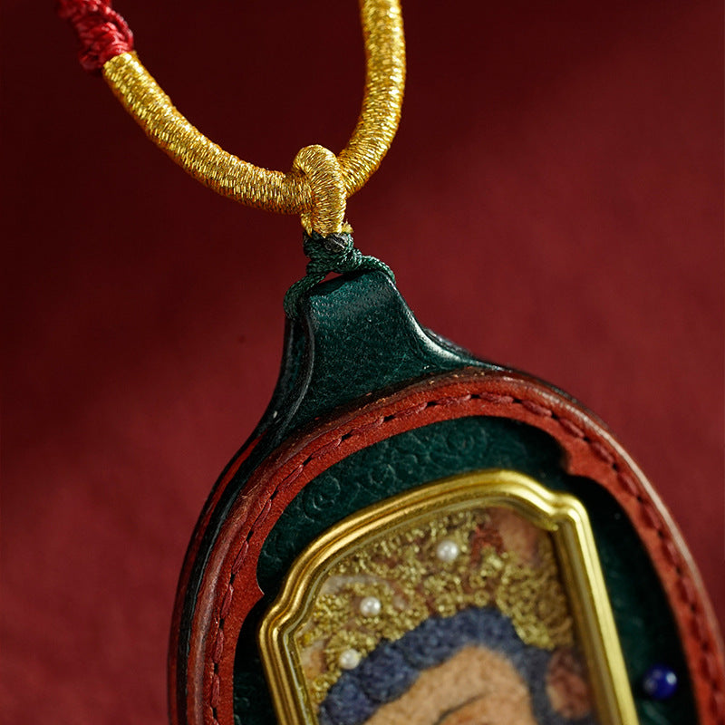 Close-up of hand-painted Thangka detail on Tibetan Gau Box necklace