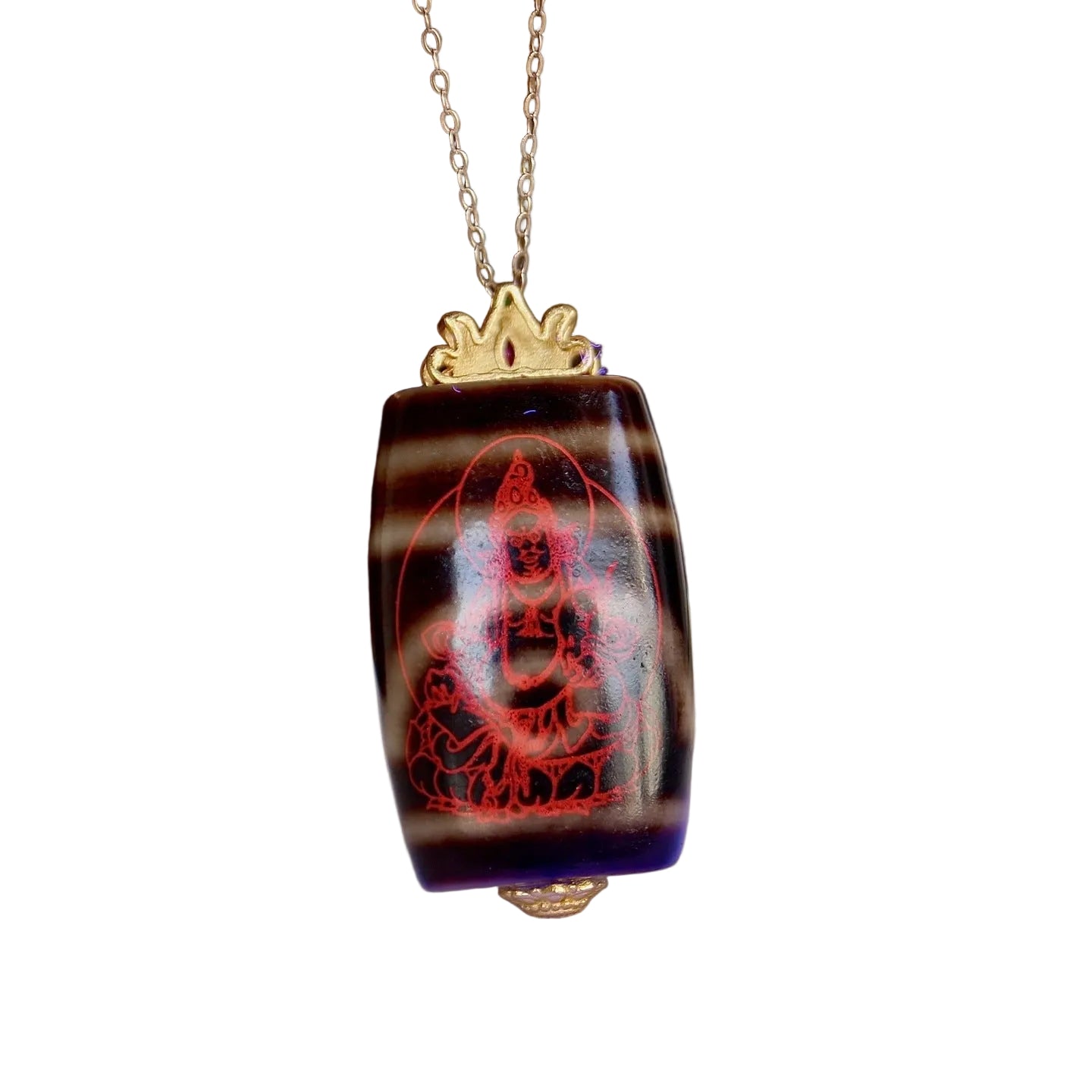 Two eyed Tibetan dzi bead pendant symbolizing wealth and protection
