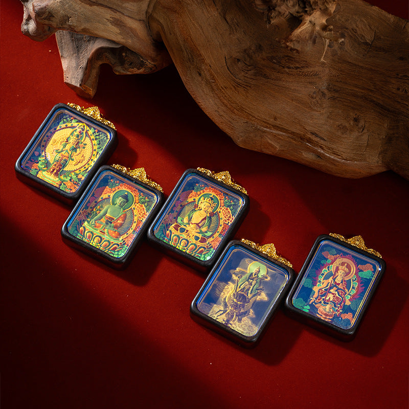 Collection of wooden thangka gau box necklaces with different deity designs
